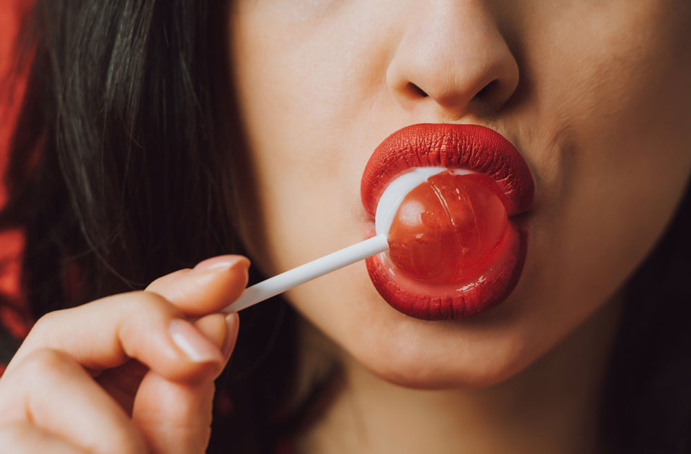 beautiful-woman-eating-a-fruity-lollypop